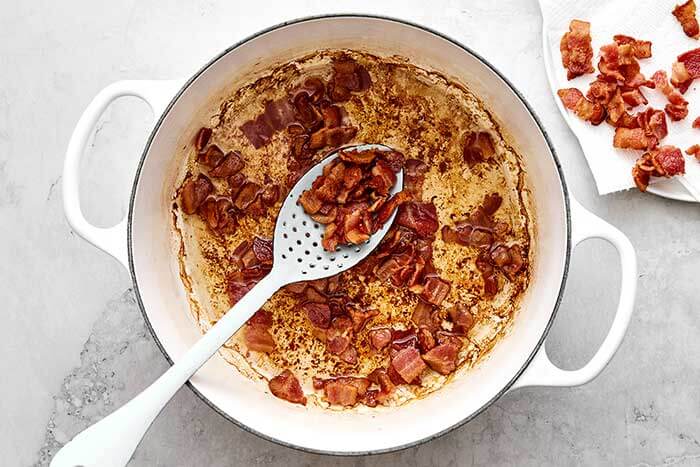 Cooked bacon in a pot.