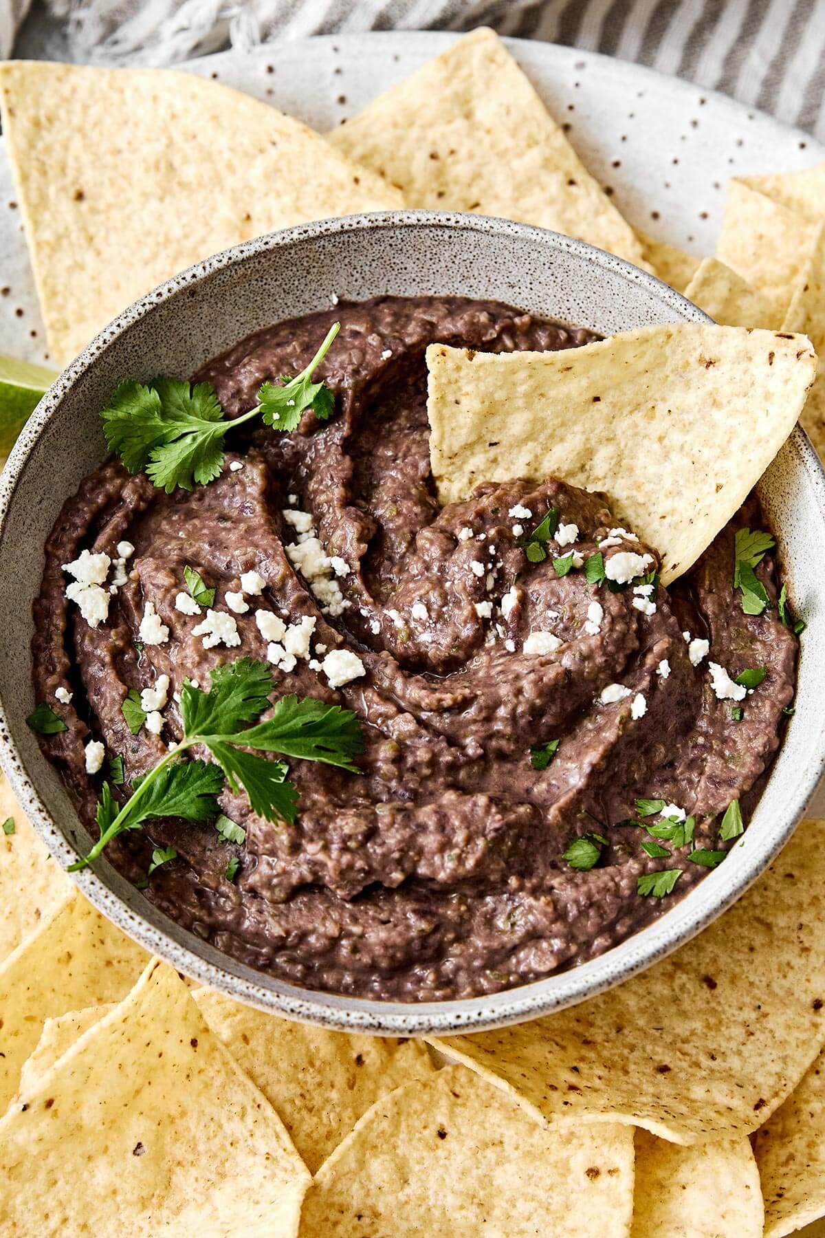 Creamy black bean dip with tortilla chips.