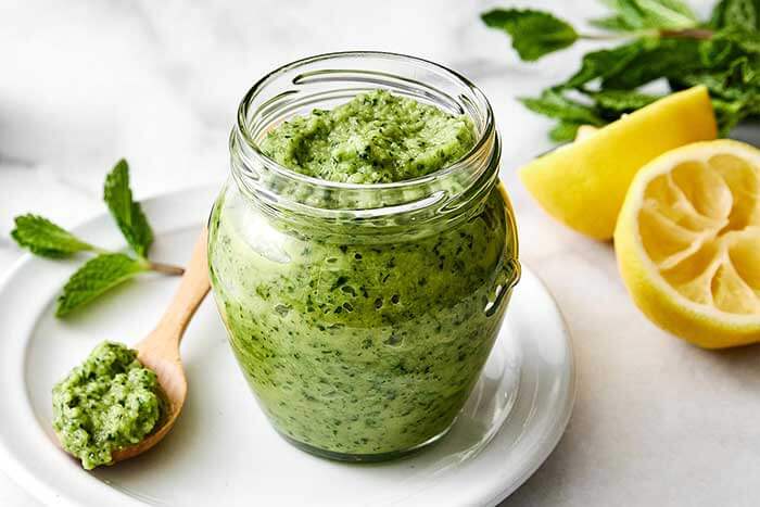Mint apple sauce in a glass jar.