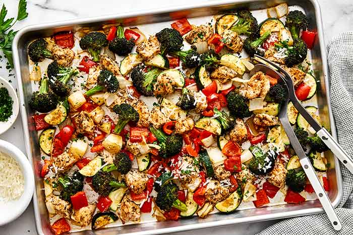 Sheet pan dinner filled with Italian chicken breast and veggies.