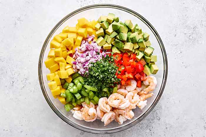 Shrimp salad ingredients in a bowl.