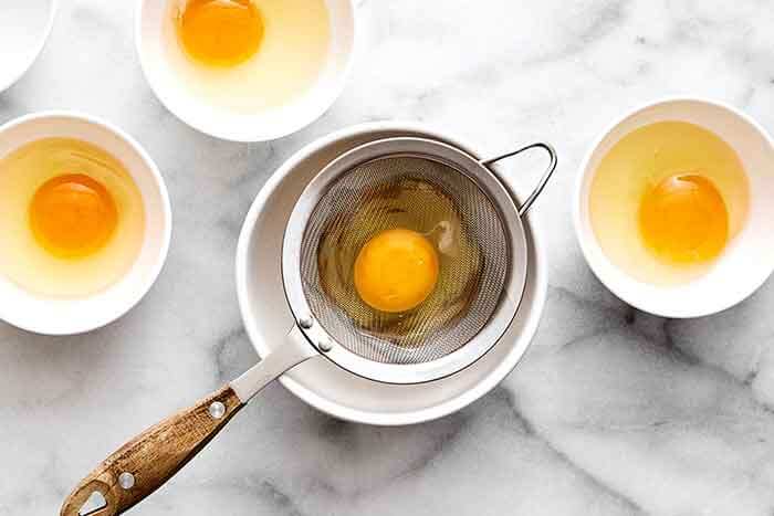 Prepping poached eggs.