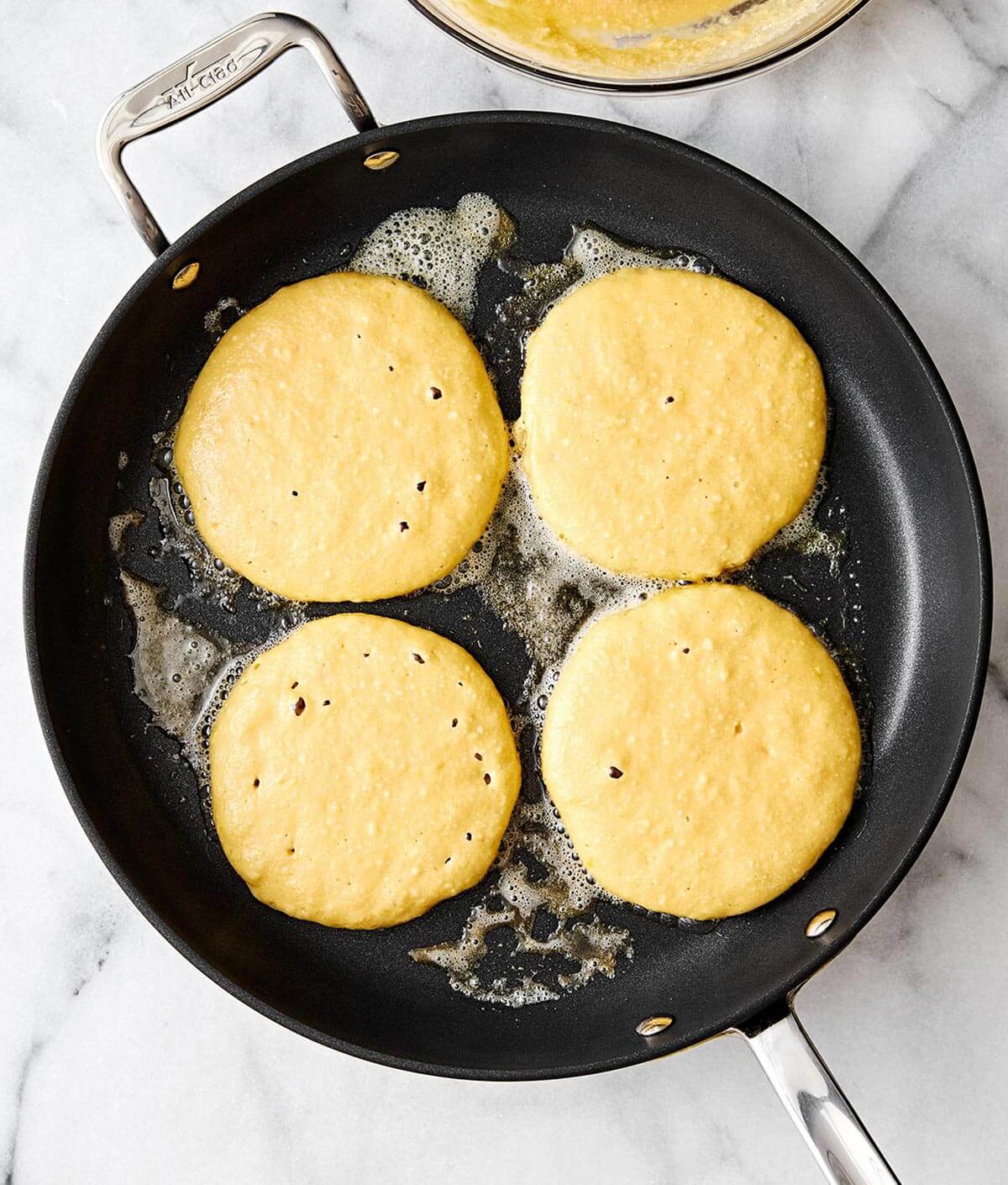 Cooking protein pancakes in a pan.