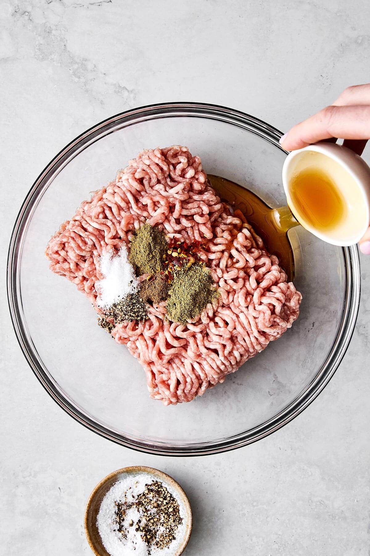 Mixing breakfast sausages.