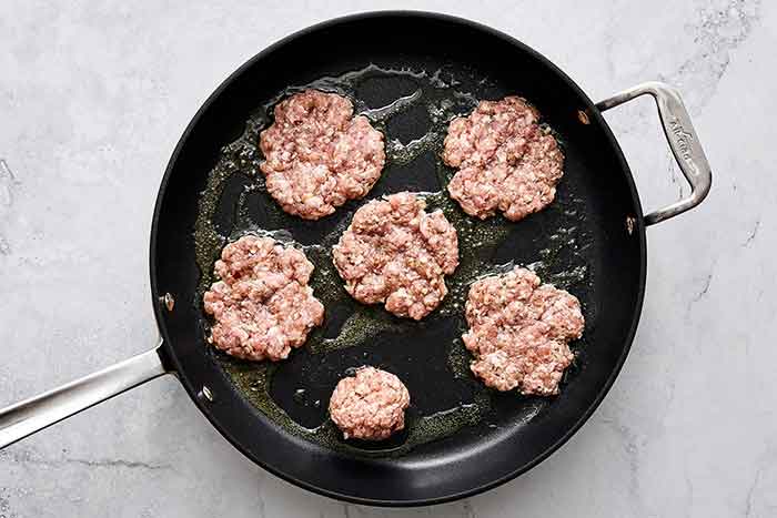 Cooking breakfast sausages.