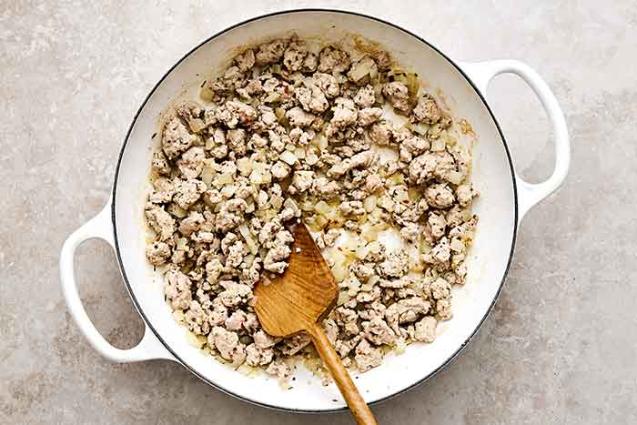 Cooking ground turkey in a pan.