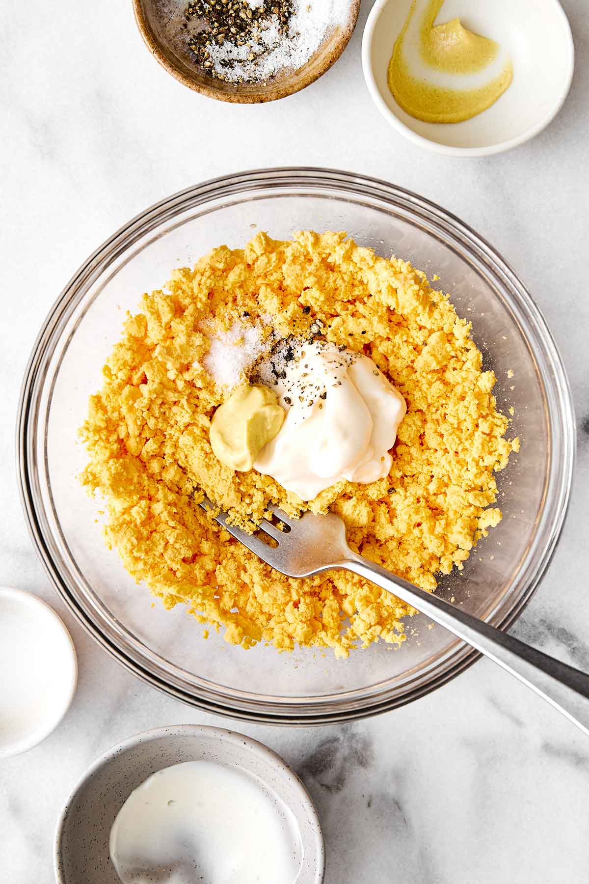 Making the deviled egg filling.