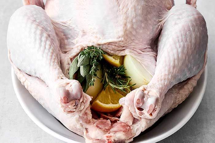 Fresh herbs and aromatics stuffed into the cavity of the turkey.