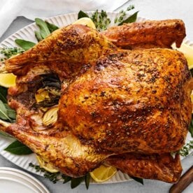 Cooked Thanksgiving turkey on a serving platter.