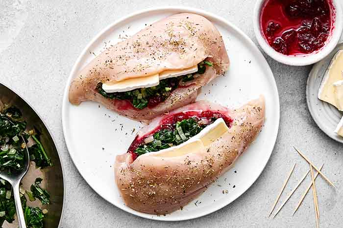 Before baking the stuffed chicken.