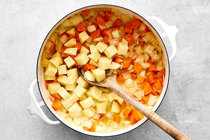Step one of red lentil soup: cook the vegetables.