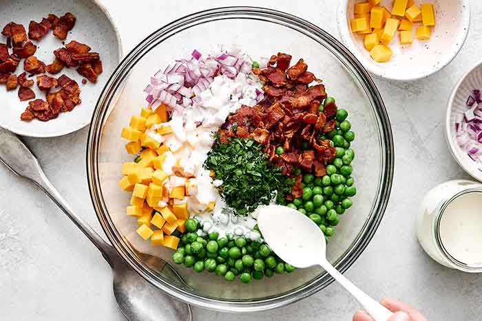 Step three of pea salad: mix it all together.