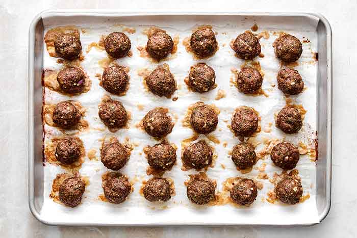 Step three of lamb meatballs: bake in oven.