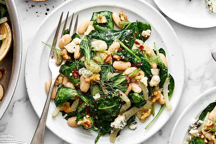 How to make a warm spinach and white bean salad.