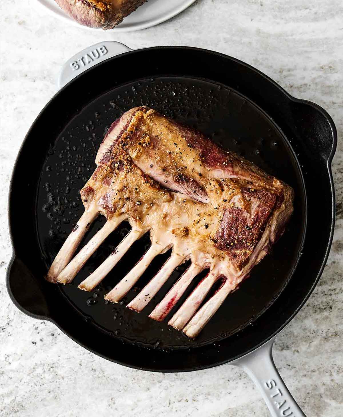 This rack of lamb with a Dijon herb crust will certainly shine at any holiday dinner. Plus, it's a lot easier to make than it looks! Step two of rack of lamb: sear the lamb.