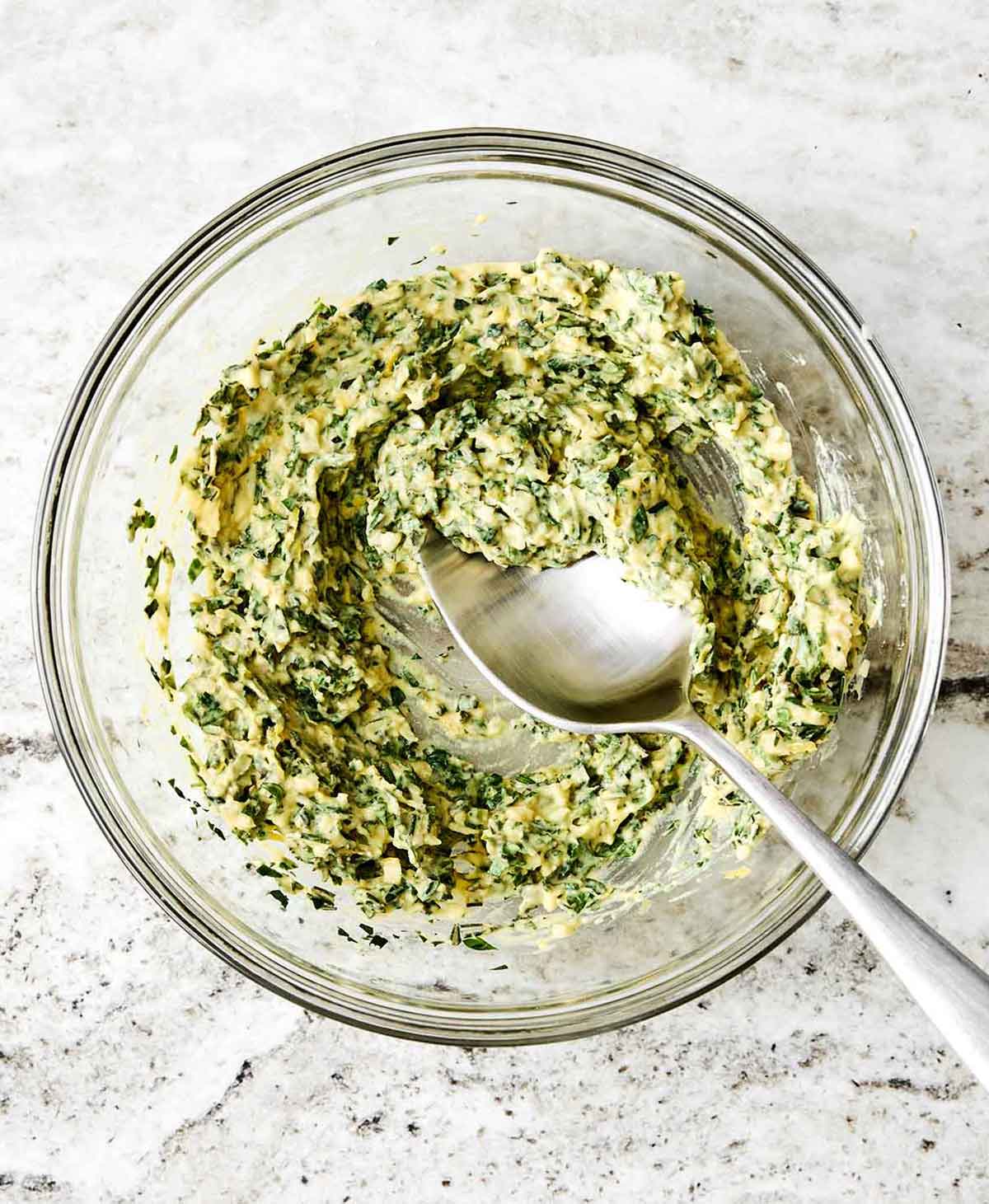 This rack of lamb with a Dijon herb crust will certainly shine at any holiday dinner. Plus, it's a lot easier to make than it looks! Step three of rack of lamb: make herb butter.