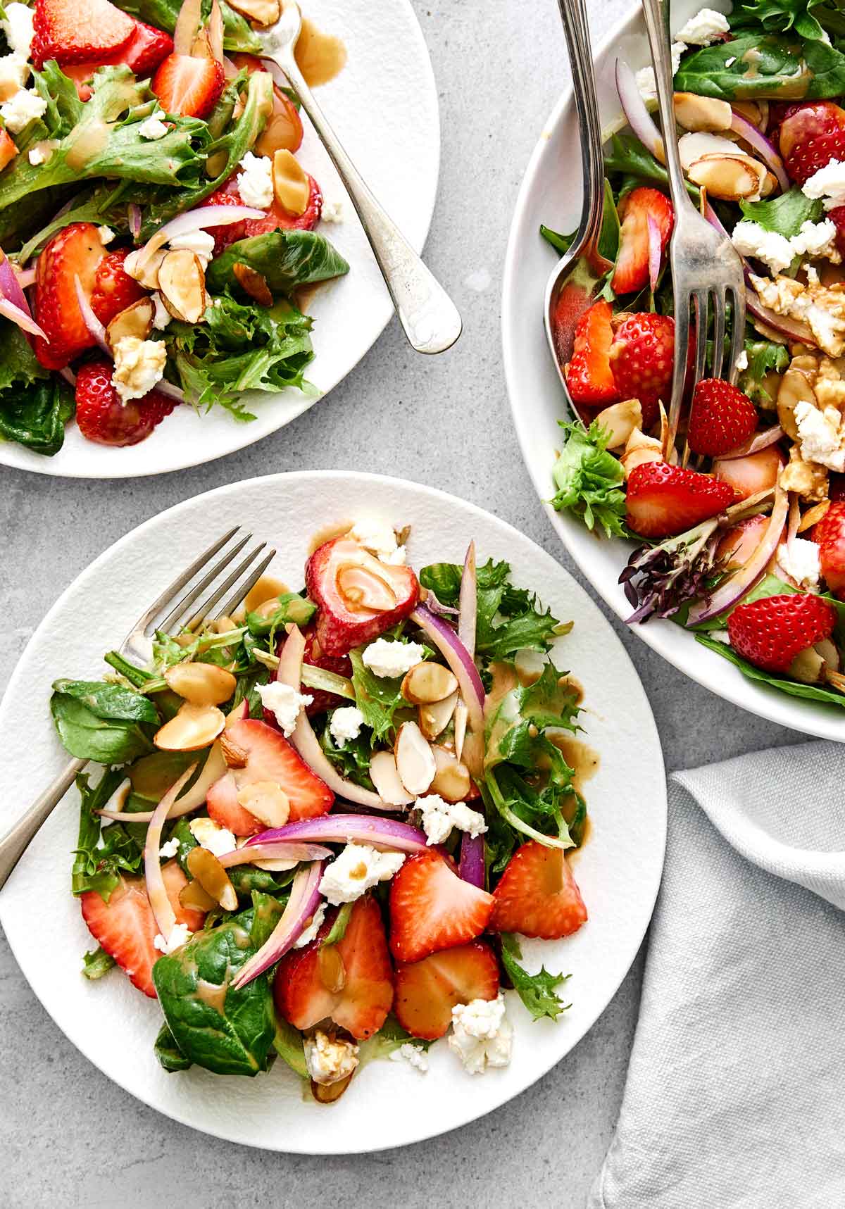These healthy homemade salad dressings are the key to enhancing every salad recipe on my website! Some are creamy dressings, while others are bright and tangy vinaigrettes. But each will make every spring salad and summer salad into a delicious one. Healthy salad dressings featuring a strawberry salad with balsamic.