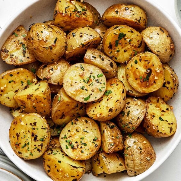 Best side dishes to serve with steak featuring garlic roasted potatoes.